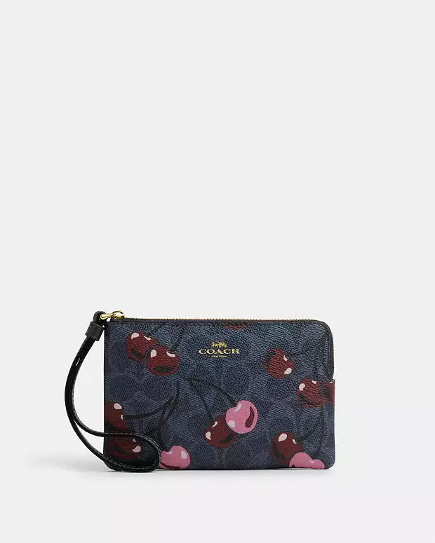 COACH CORNER ZIP WRISTLET IN SIGNATURE CANVAS WITH CHERRY PRINT