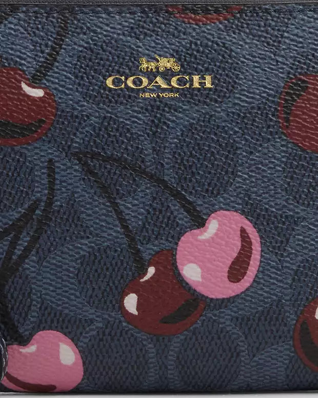 COACH CORNER ZIP WRISTLET IN SIGNATURE CANVAS WITH CHERRY PRINT